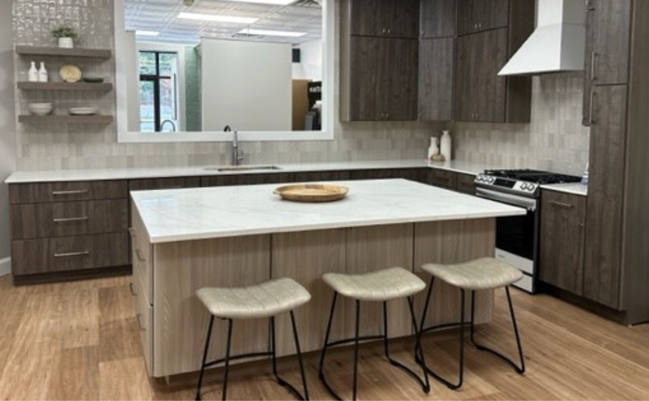 White countertops in a kitchen with wood cabinetry