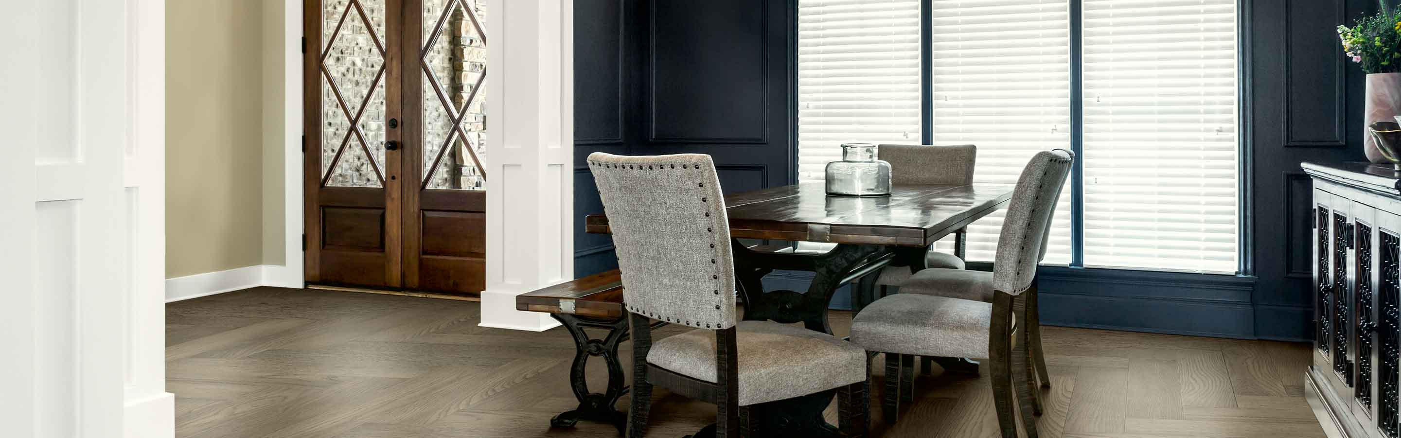 Kitchen scene with off-white window blinds. 