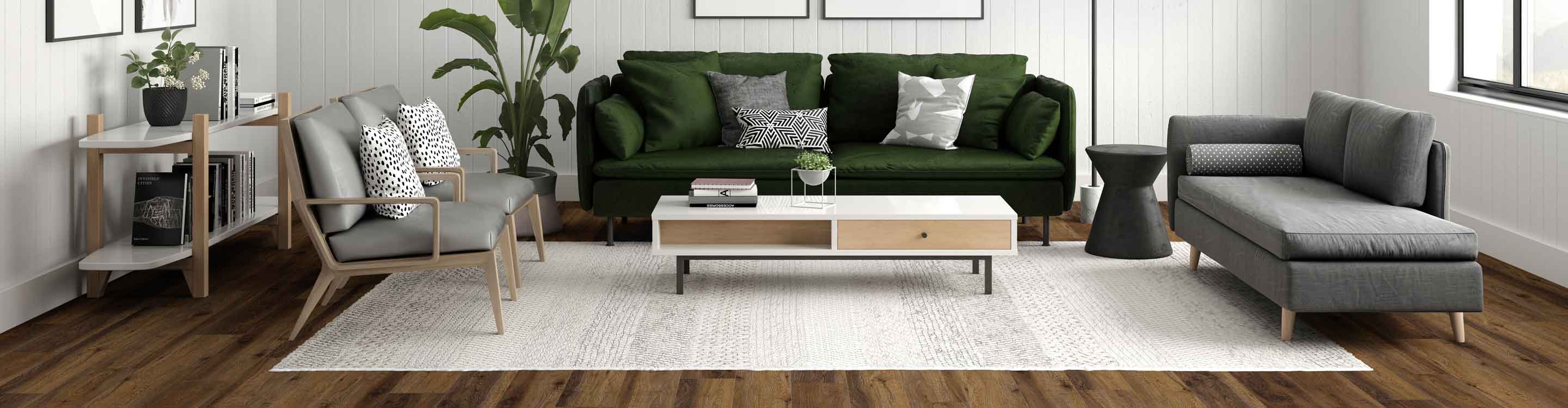 black and white pattered area rug in midcentury living room with green couch